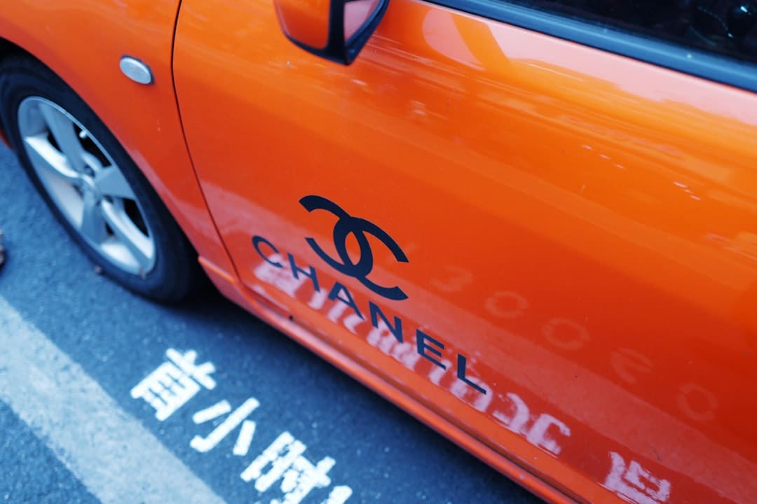 Air Carrier Access Act. Orange car with chanel logo and text