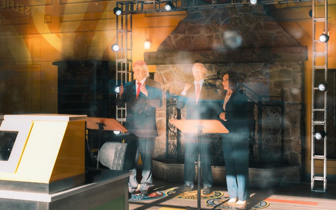 FHA ADA conflict. Three people stand behind podiums on a stage.