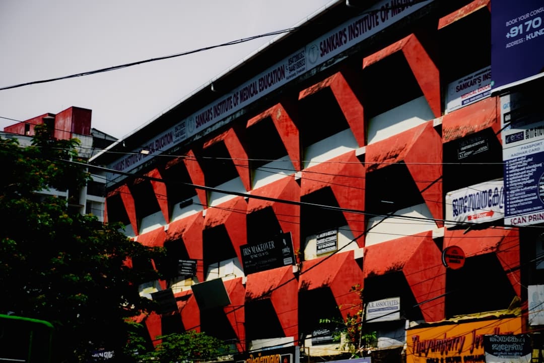 Section 504 service dogs. Building with red and white geometric facade details.
