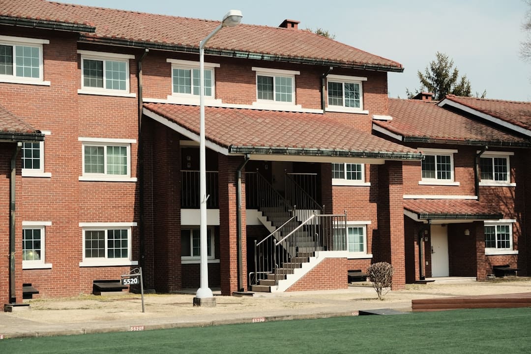 HUD 2020 guidance. Brick apartment building with outdoor stairs and windows