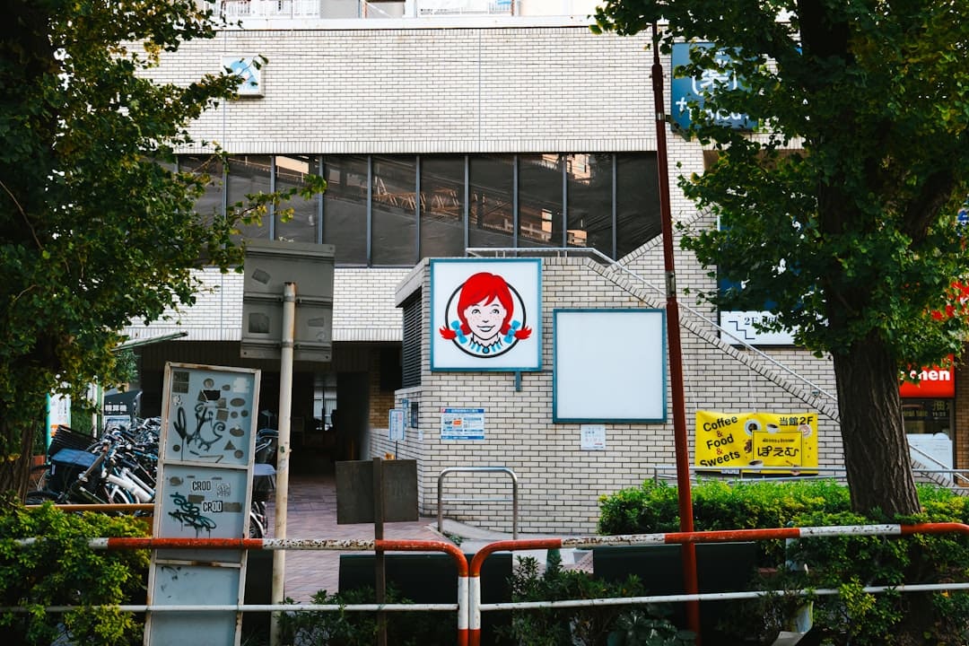 Air Carrier Access Act — a brick building with a sign and trees in front of it